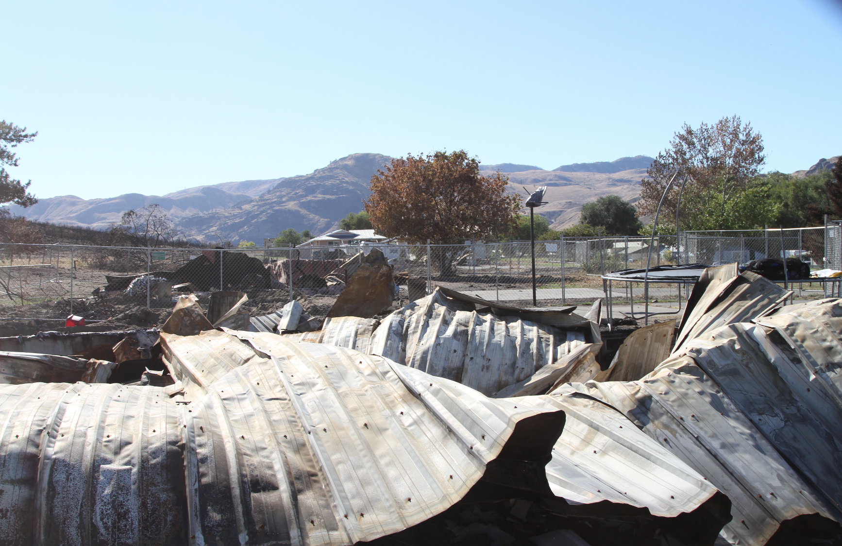 A 6 foot tall safety fence has been put up around the three burned foundations of Colville Indian Housing Authority houses that burned in the CIHA Malott housing development during the Cold Springs Fire that started over the long Labor Day Weekend.